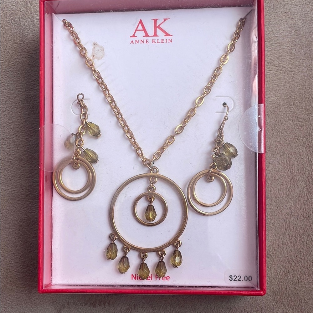 Anne Klein Gold Necklace with Circular Pendant and Teardrop Charms